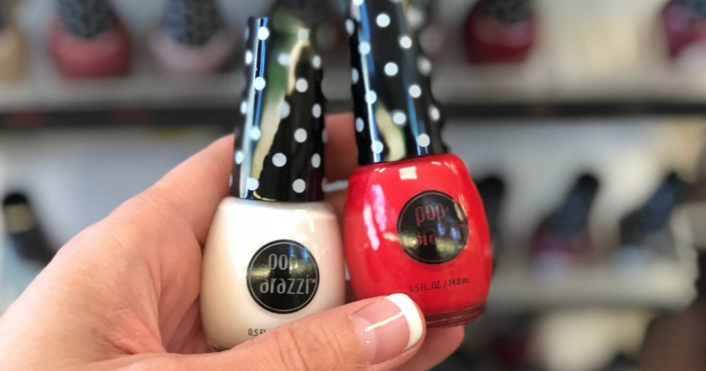 Hand holding Pop·arazzi Nail Polish