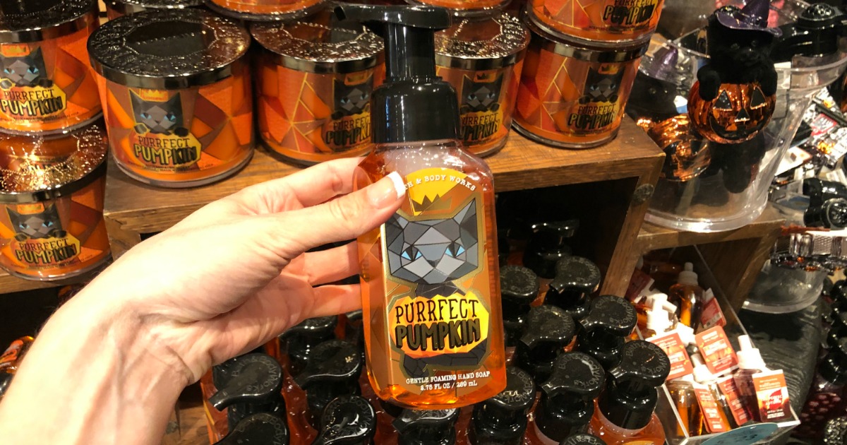 Woman holding bottle of Bath & Body Works Purrfect Pumpkin Hand Soap