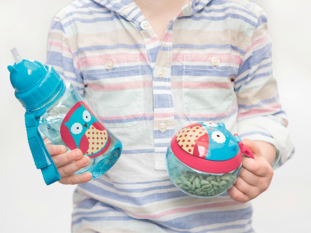 boy holding Skip Hop Owl Snack Cup and water bottle