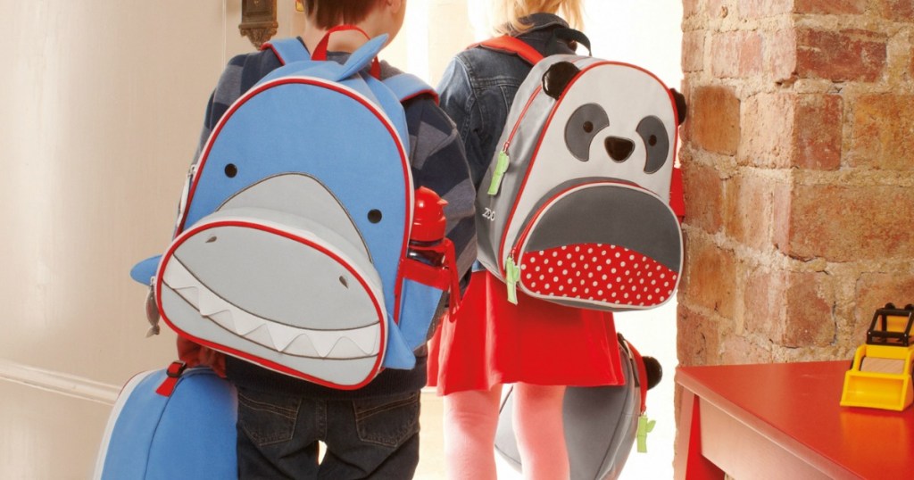 boy with Skip Hop Shark Backpack walking out door