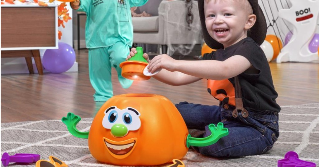 boy playing with step2 my first jack o lantern toy