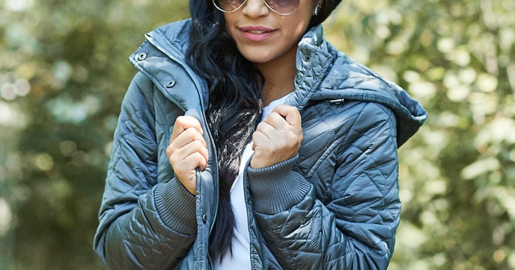 woman wearing jacket and sunglasses