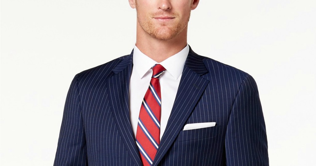 man wearing navy pinstripe suit jacket