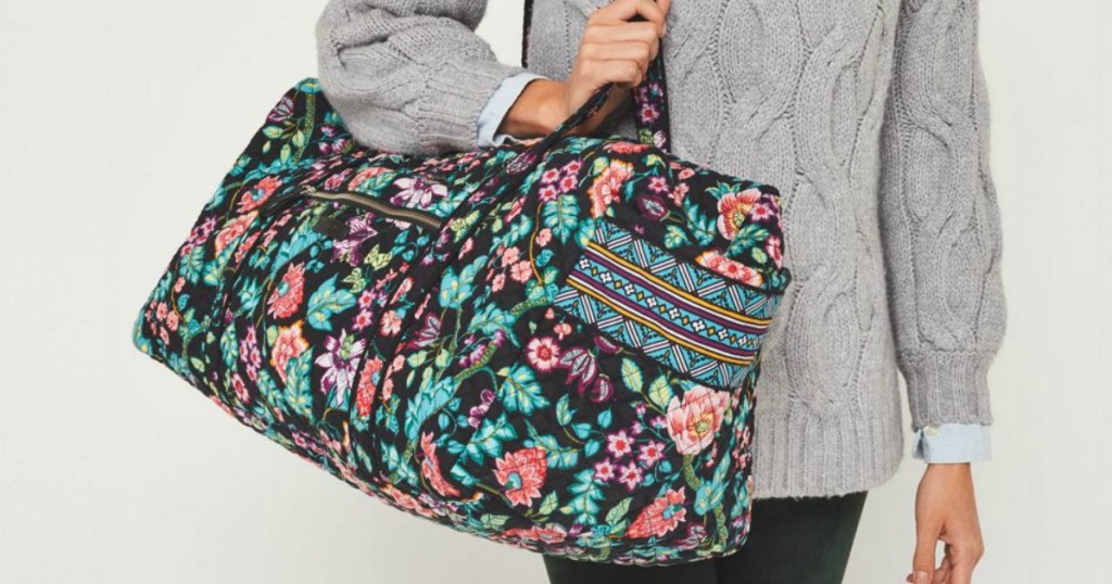 Vera Bradley Travel Duffel on woman's shoulder