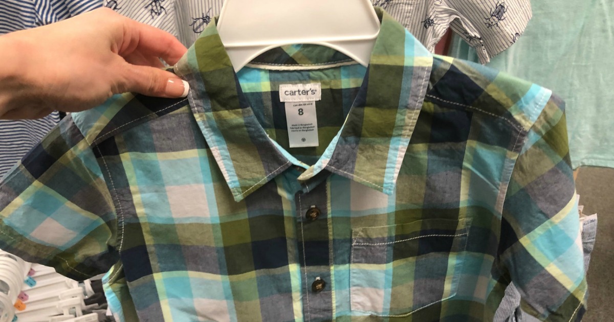 hand holding plaid little boys shirt on hanger