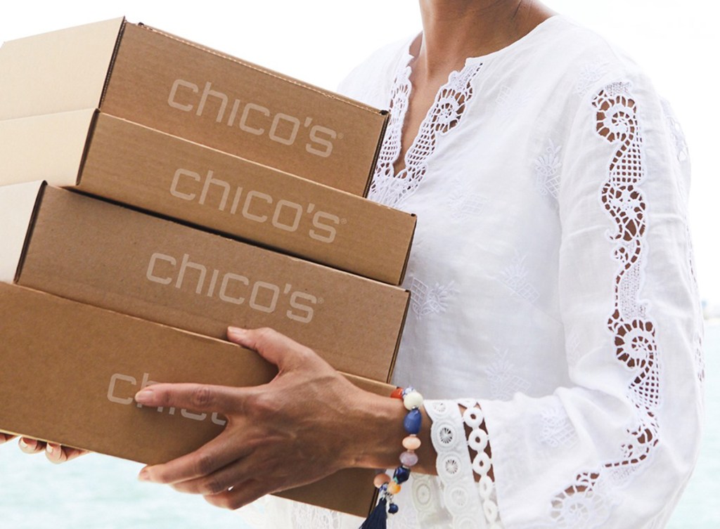 woman carrying Chico's boxes