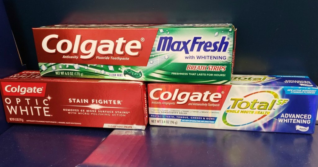 three tubes of colgate toothpaste