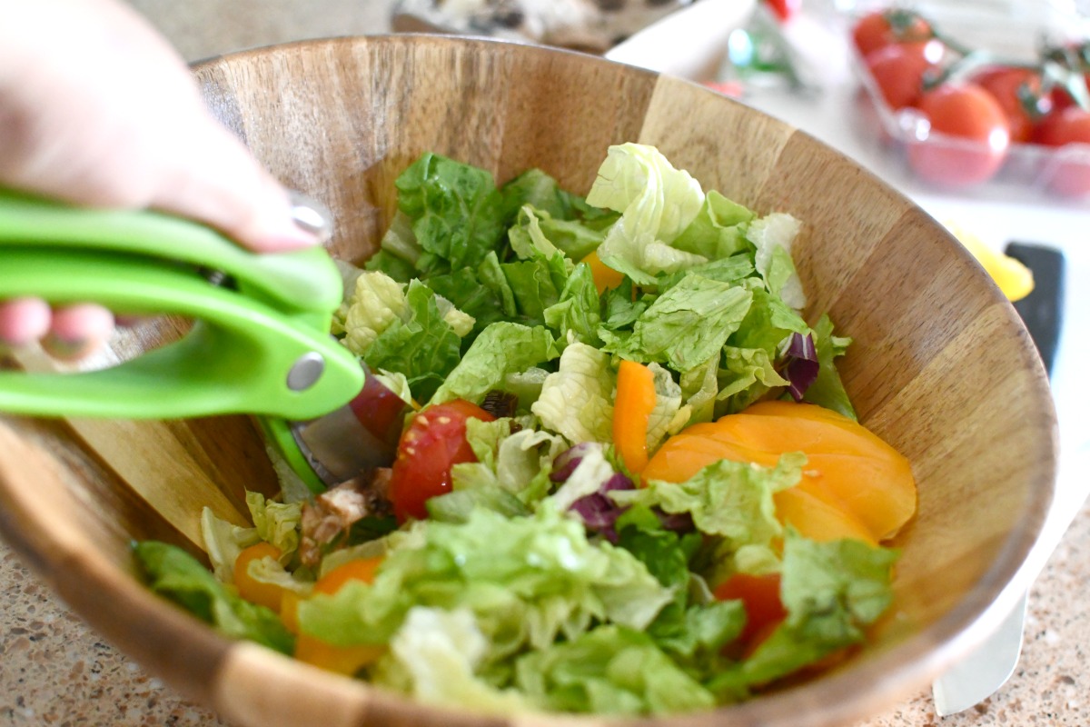 cutting salad right in the bowl with toss and chop scissors