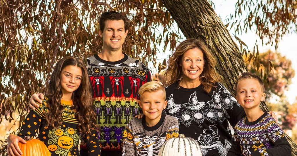 family wearing ugly Halloween sweaters