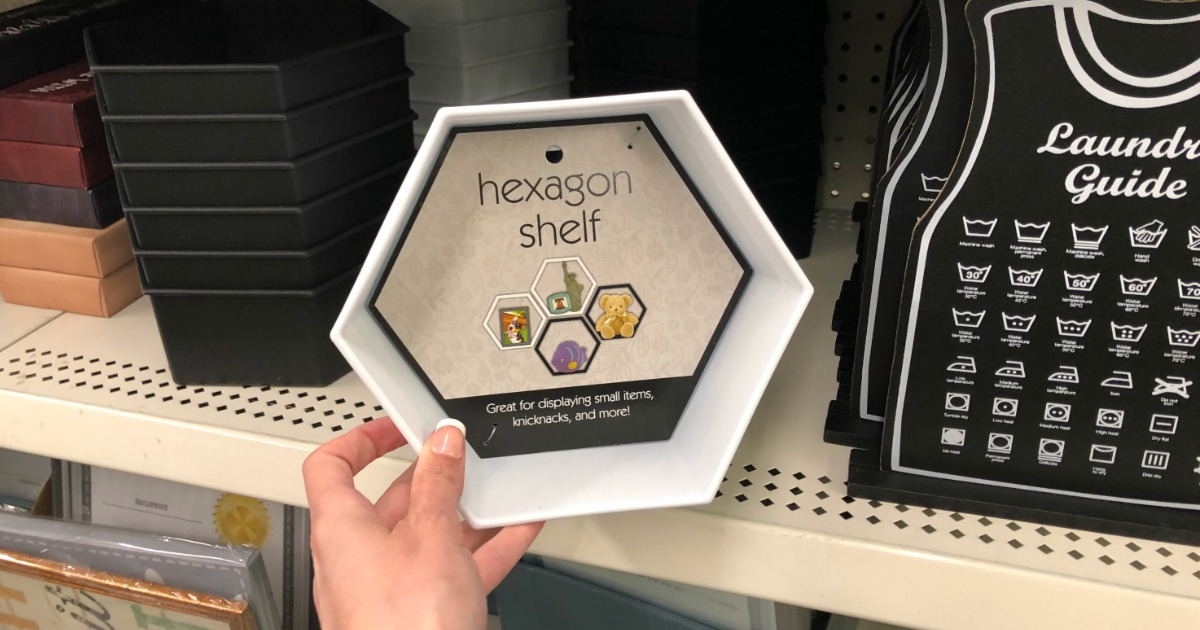 woman holding white hexagon shelf