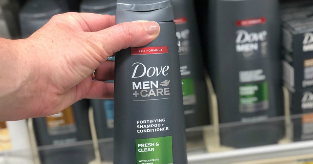 dove men+care shampoo and conditioner held in store