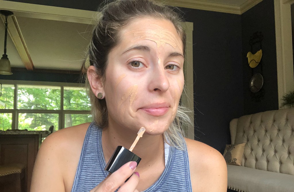 emily applying wet n wild foundation