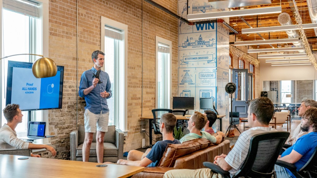 man teaching course in front of group