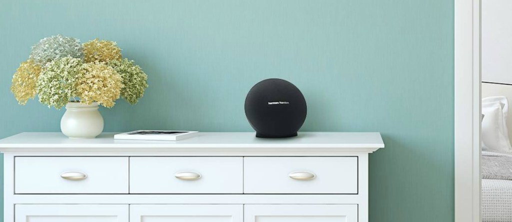 HarmanKardon brand bluetooth speaker on dresser