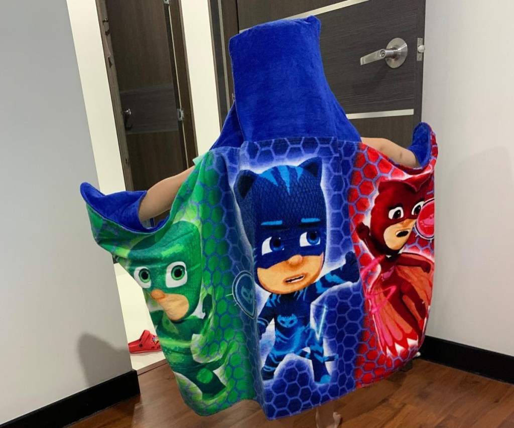 child wearing PJ Masks hooded towel