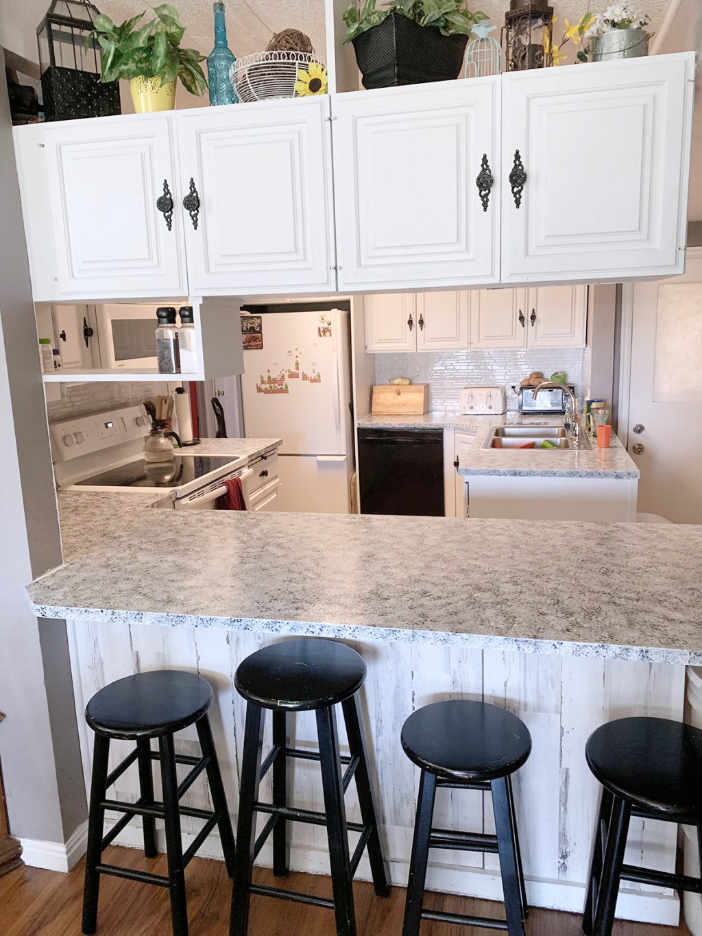 ktichen transformation after with white cabinets and refinished countertop