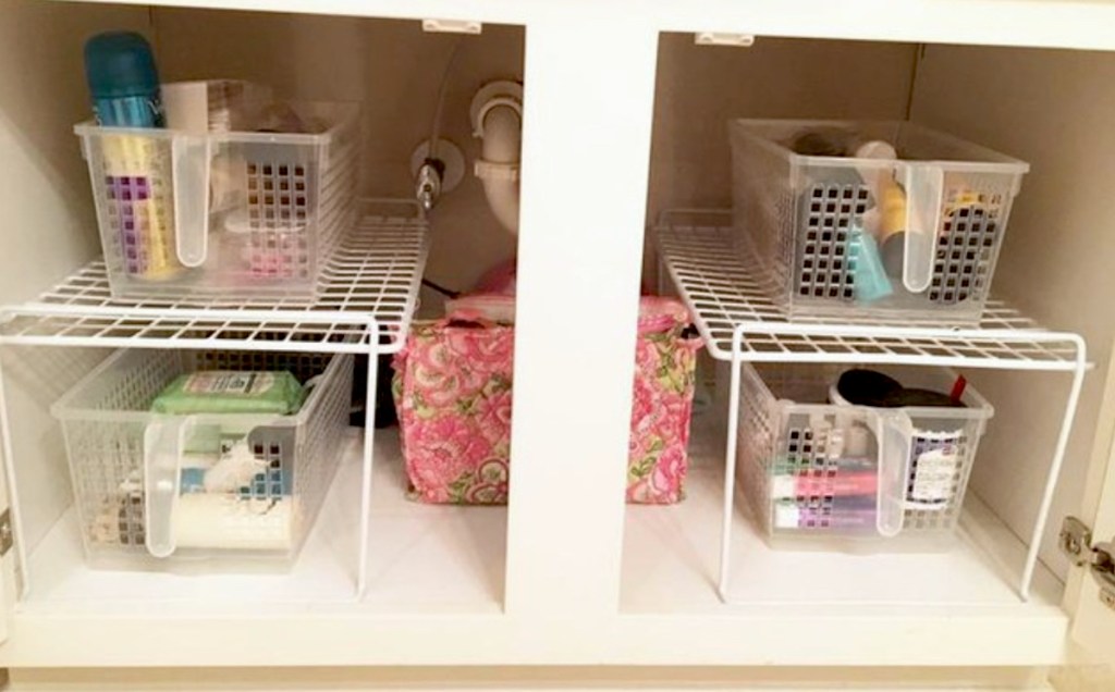 bathroom sink with clear pantry baskets under sink