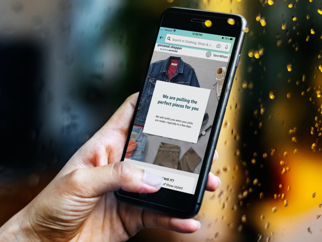 hand holding a phone with amazon personal shopper on screen