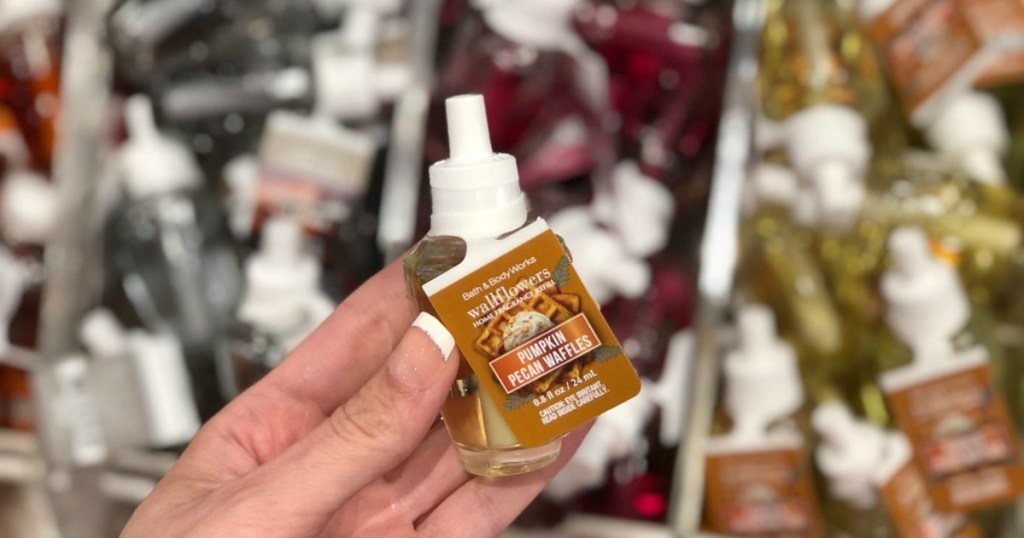 pumpkin pecan waffles Wallflower refill held in hand