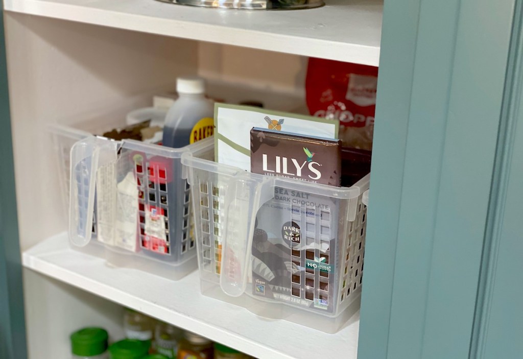 clear containers on pantry shelf with food