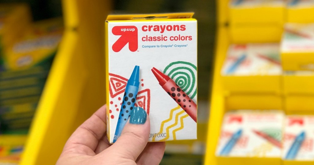 hand holding up & up crayons at target