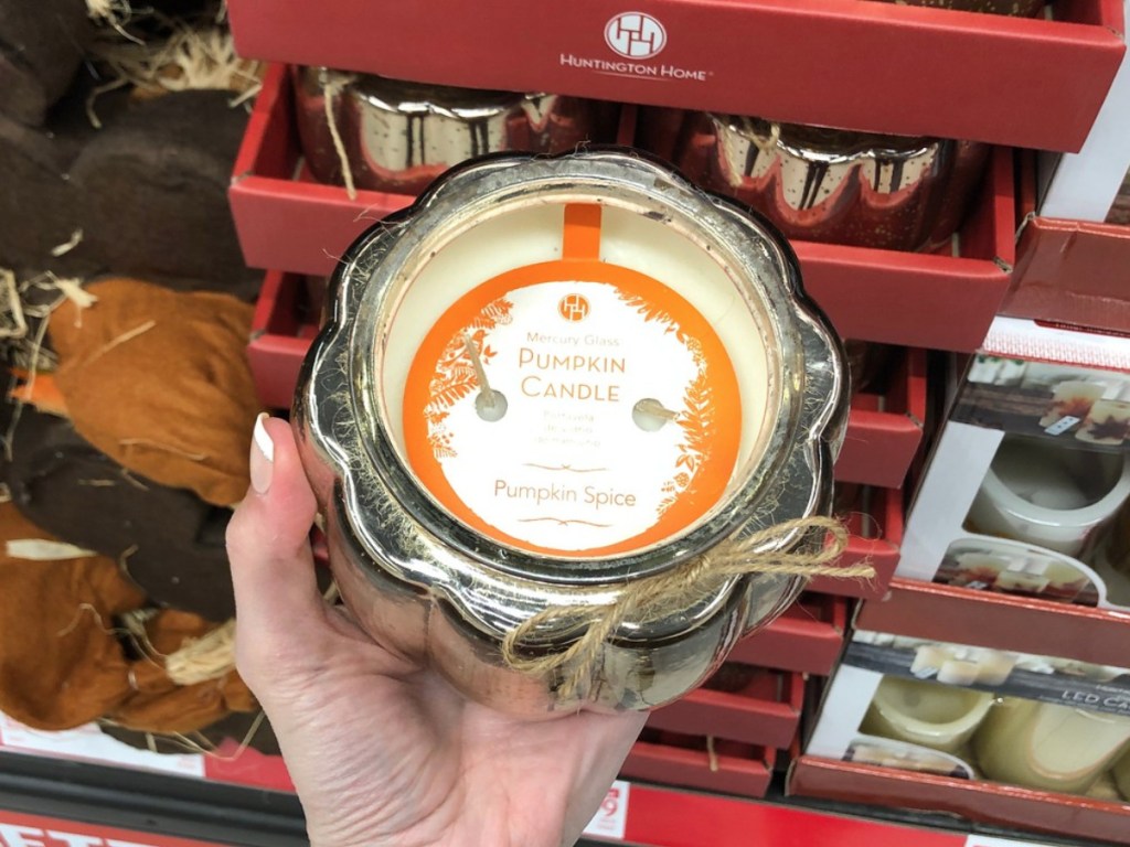 hand holding Aldi pumpkin spice candle