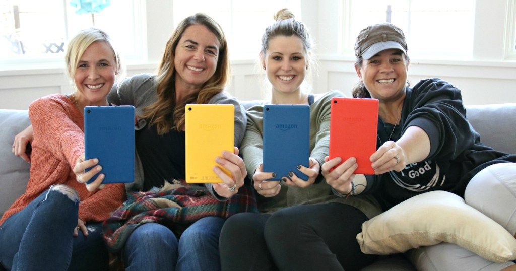 women holding Amazon Fire HD 8