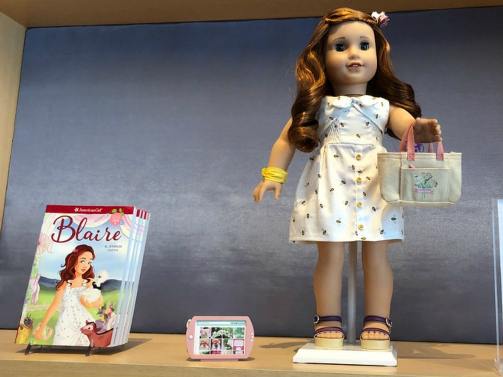 American Girl Doll and a book in American Girl Store