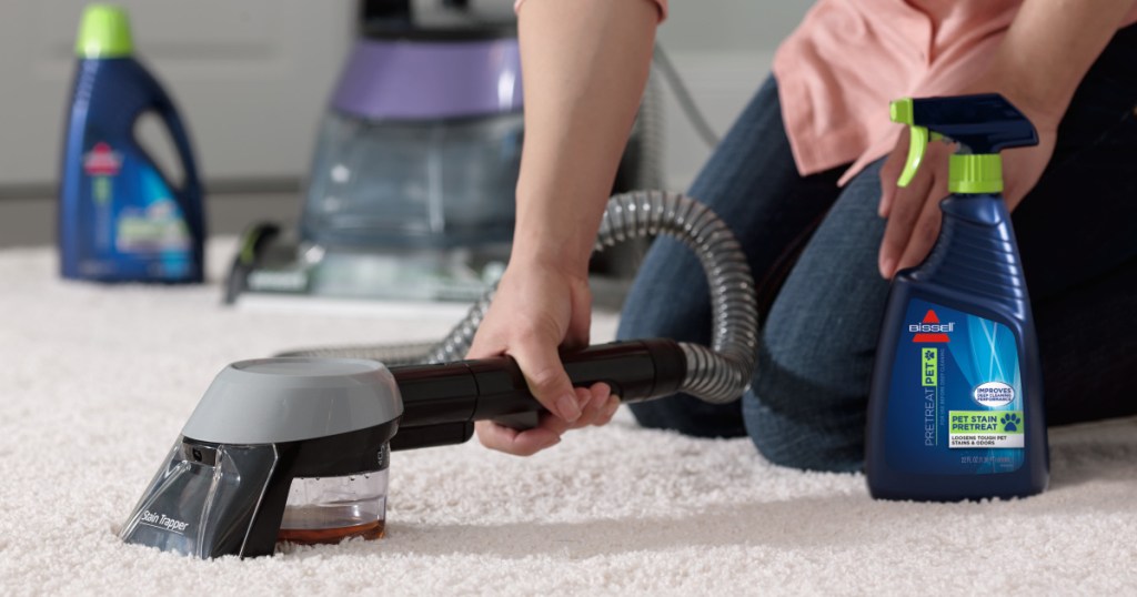 woman cleaning carpet with bissell depclean deluxe