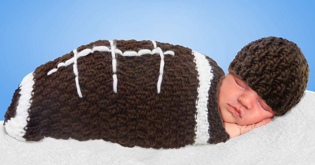 newborn wearing crochet football costume