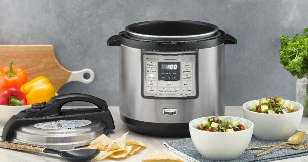 Bella Multicooker on table with bowls of food by it