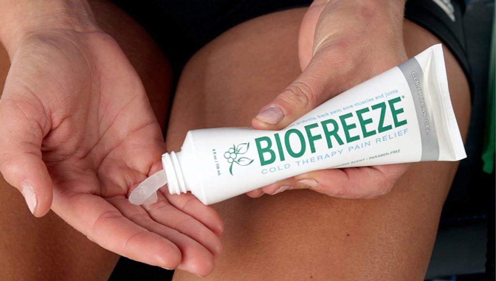 Biofreeze Pain Relief Gel 4-Ounce Tube clear gel being squeezed into a hand