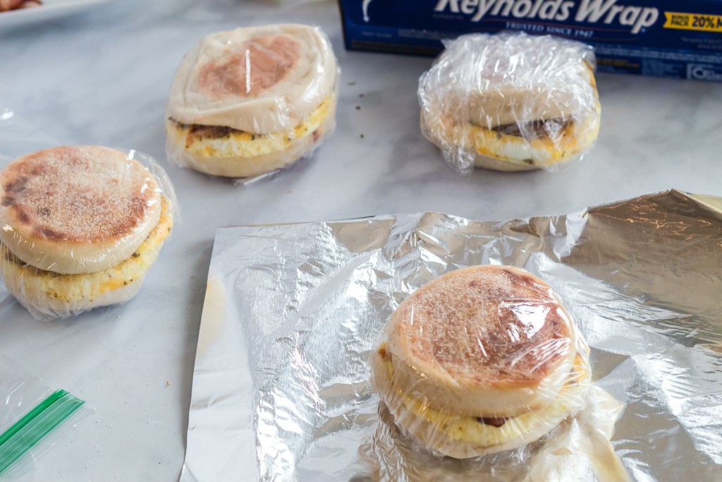 breakfast sandwich wrapped in plastic wrap and foil