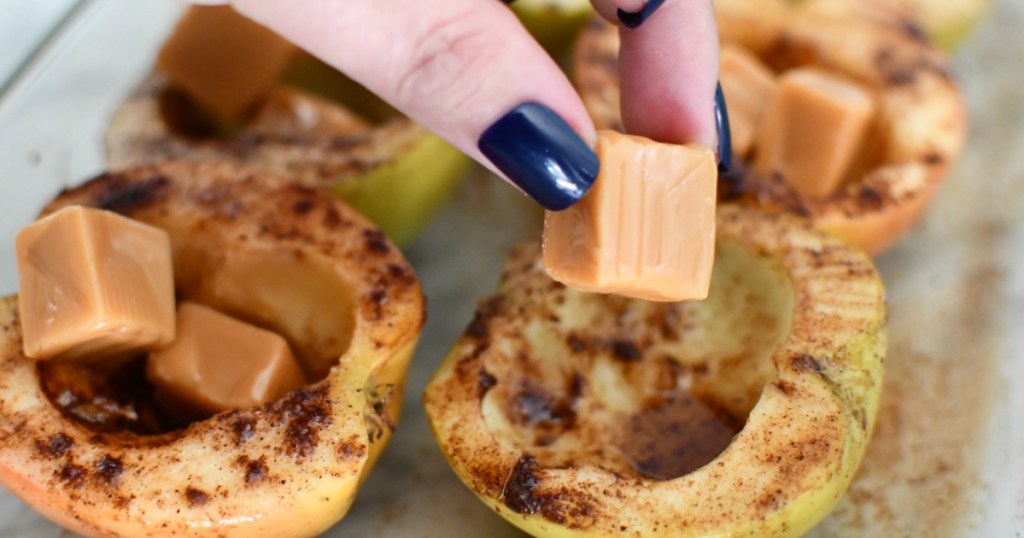 adding caramel to apples