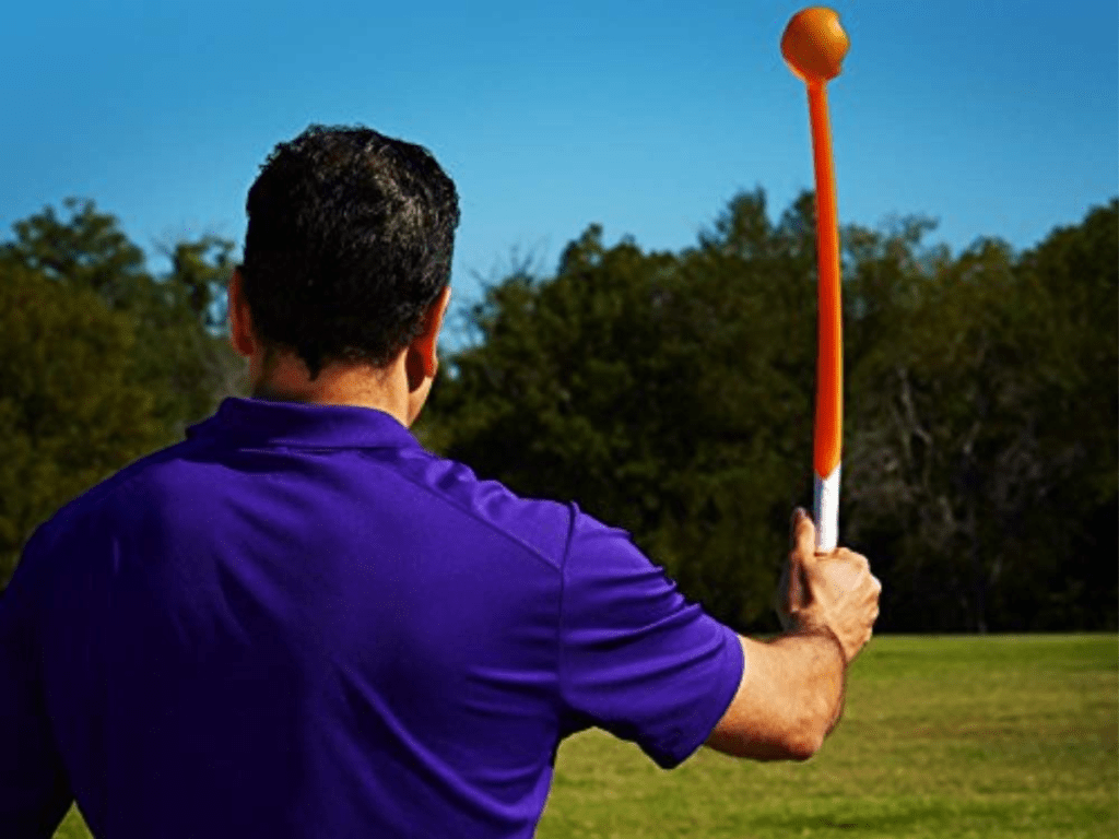 man using launch it dog toy outdoors