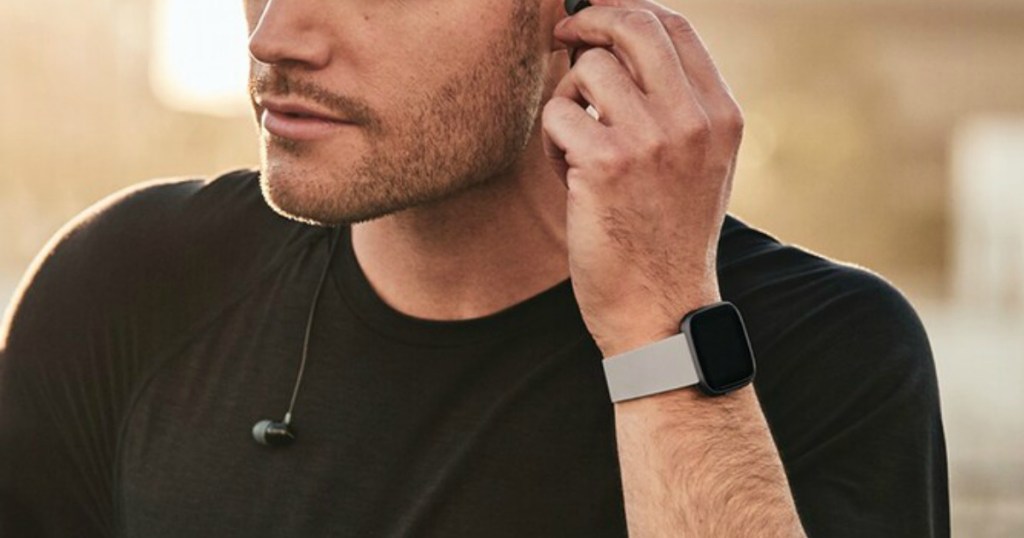 man wearing Fitbit Versa Smartwatch