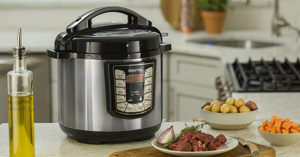 Gourmia Pressure cooker on the kitchen counter top with food