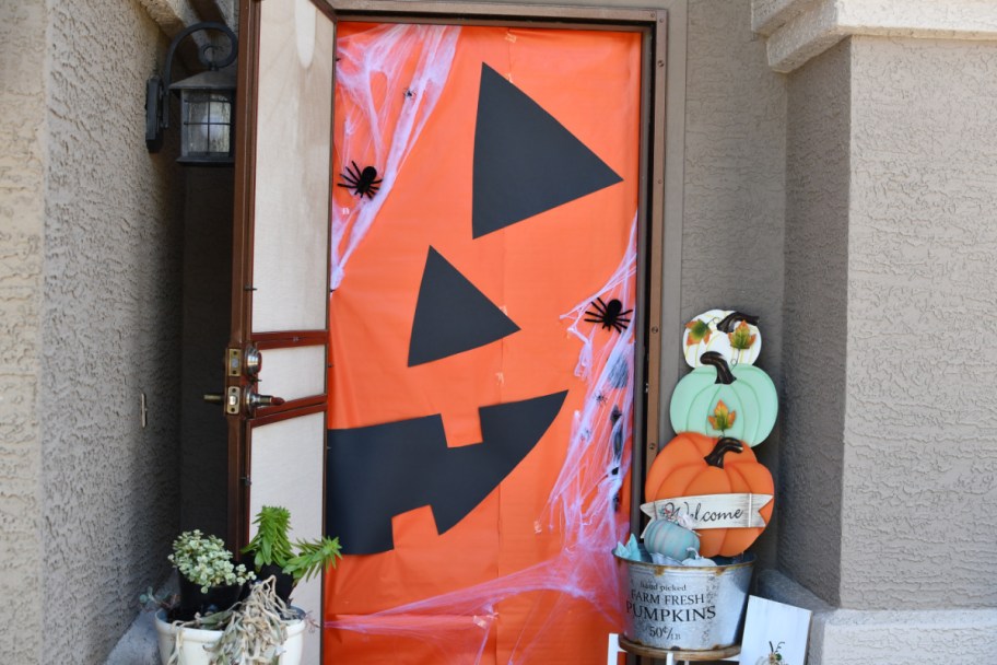 DIY Halloween front door Decorations of a jack o lantern on the Front Door