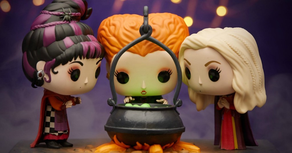 Hocus Pocus Funko Pop! figures placed around a toy cauldron