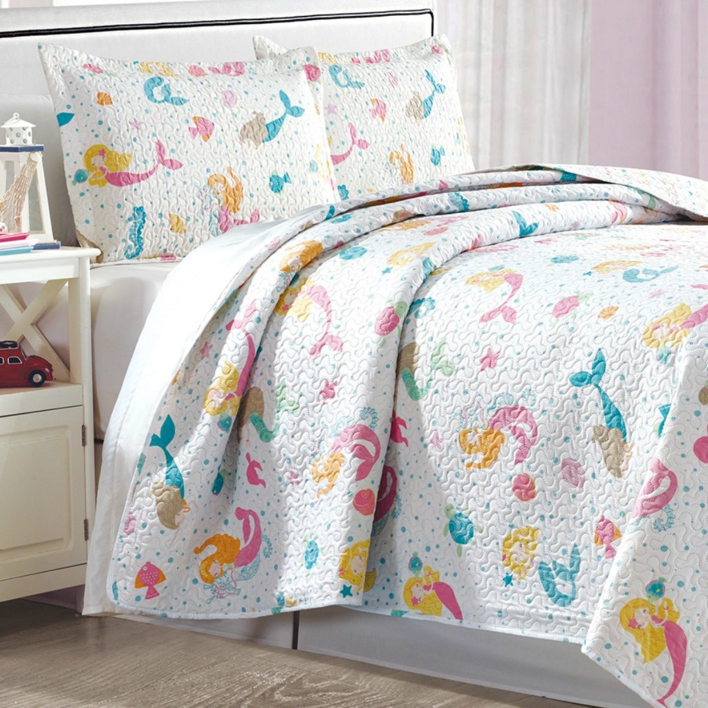 Mermaid print quilt from Zulily on a full size bed