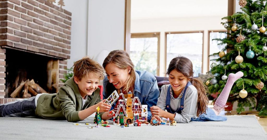 family playing with lego gingerbread house