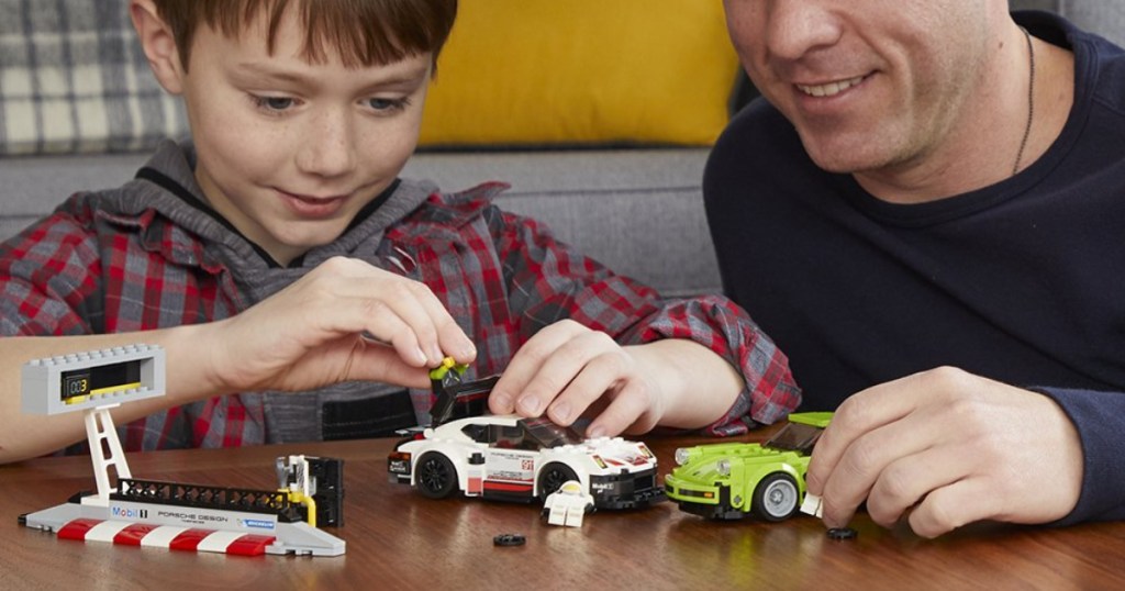 kid and dad playing with lego speed champions porche lego set