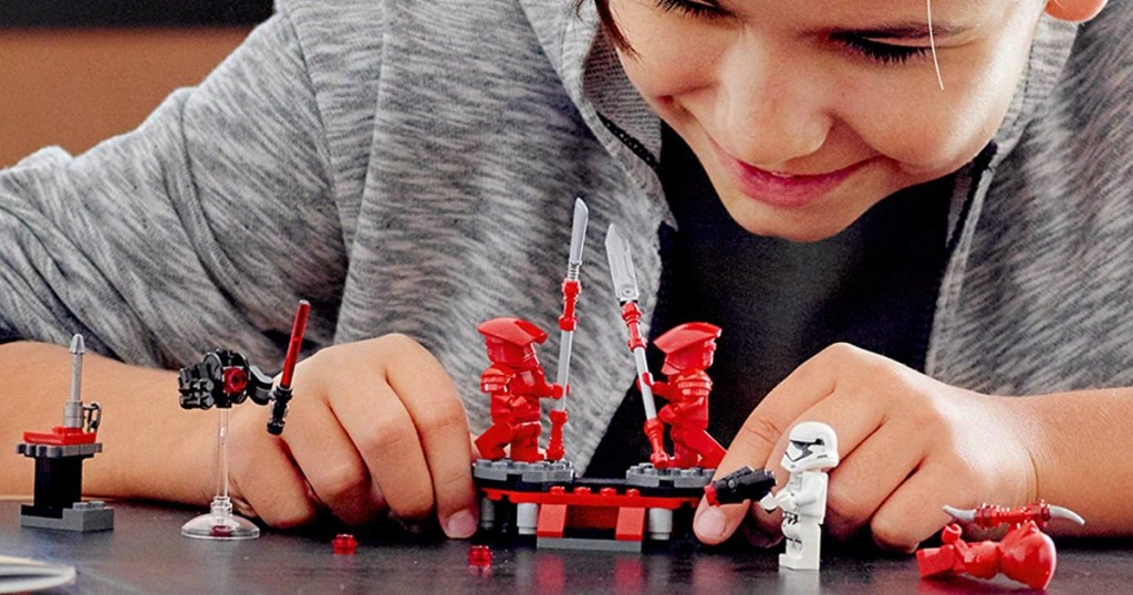 boy playing with LEGO Star Wars Elite Praetorian Guard Battle Pack