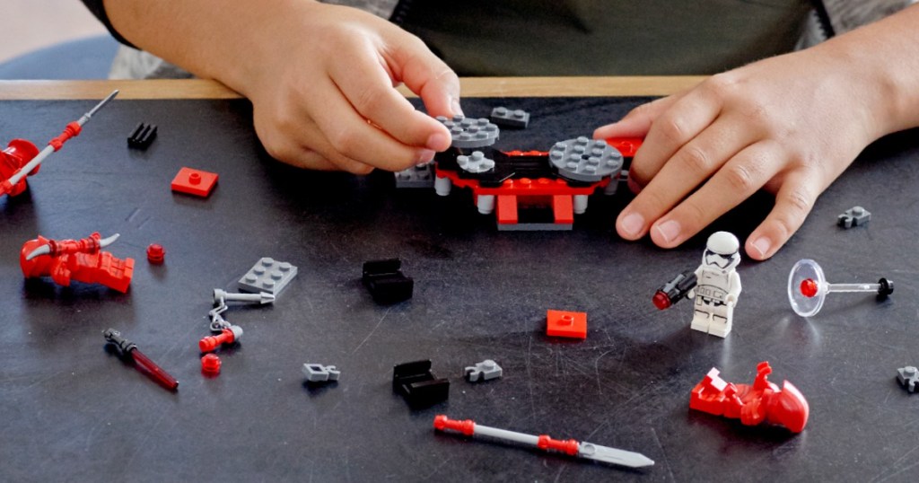 child's hands playing with LEGO Star Wars Praetorian Guard Battle Pack