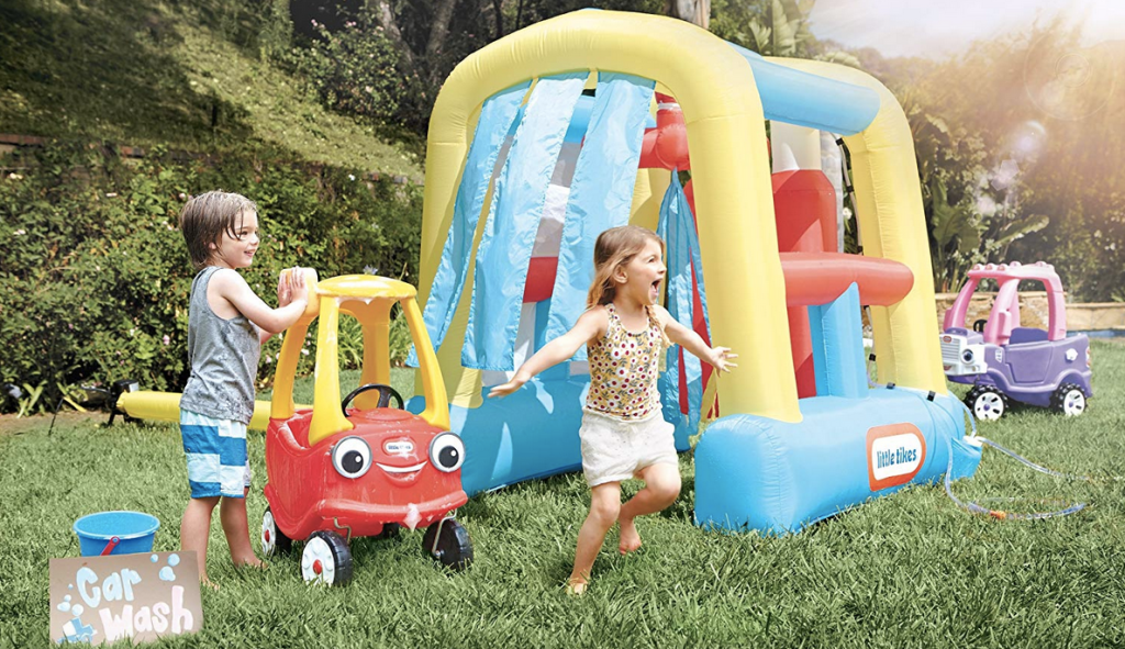 Kids playing outdoors in Little Tikes Wacky Wash