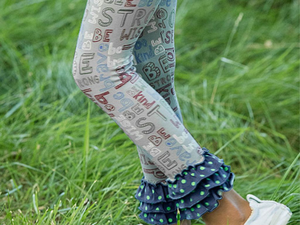 Matilda Jane Grey and Blue Ruffle Hem Wise Words Leggings on grass