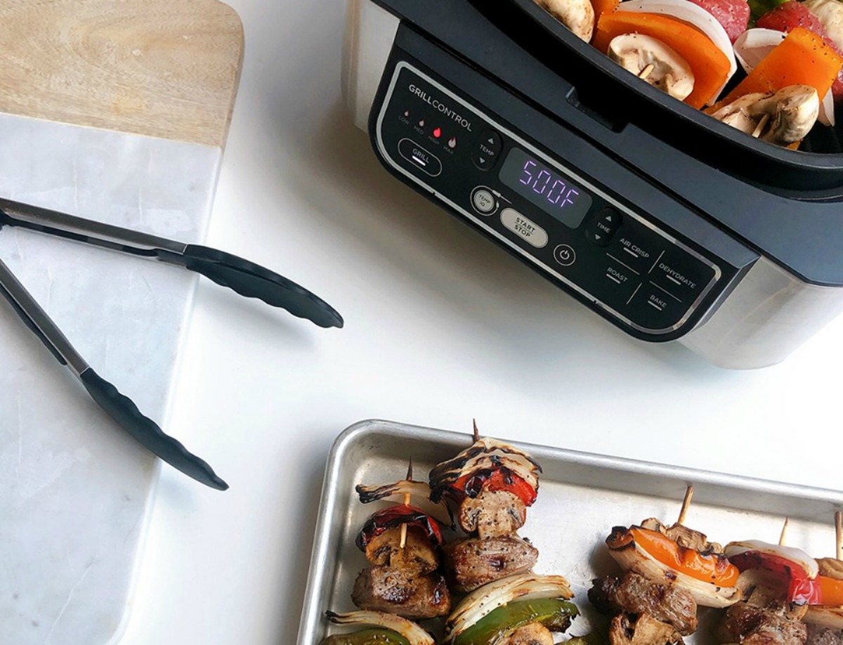 NEW Ninja Foodi 5-in-1 Indoor Grill with kebabs on a tray