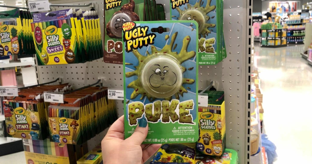 hand holding up puke ugly putty at target