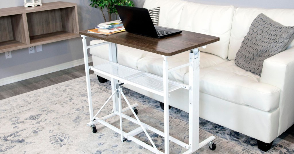 white sit stand adjustable desk and work station in living room