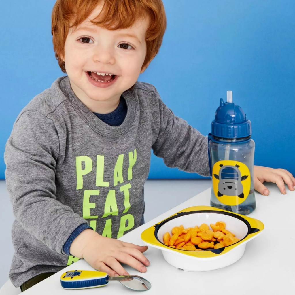 Boy at table with Skip Hop bat themed dinnerware